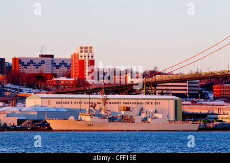 Ship tied up at Naval dockyards at dawn in winter, Halifax, Nova Scotia, Canada Stock Photo