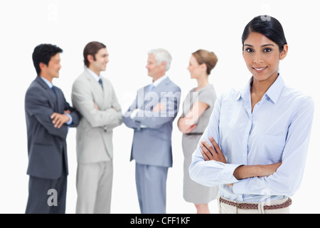 Close-up of a multicultural business team talking and a smiling woman Stock Photo