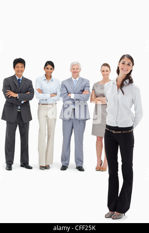 Smiling business team with a woman's hands behind her back Stock Photo