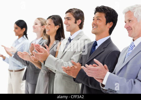 Smiling multicultural business people applauding Stock Photo