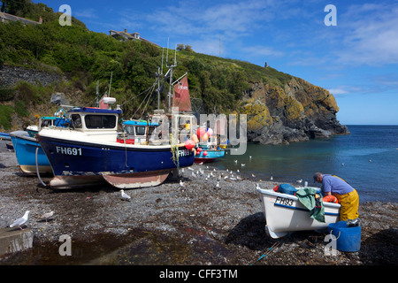 Cornish fisherman on beach at Cadgwith, Lizard Peninsula, Cornwall, England, United Kingdom, Europe Stock Photo