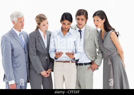Close-up of surprised business people watching a touchpad Stock Photo