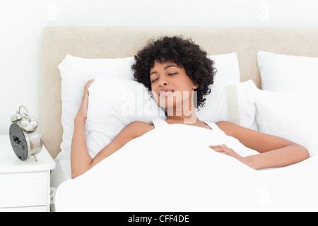 Woman with curly haired sleeping peacefully Stock Photo