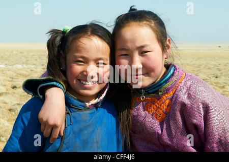 Young Mongolian girls in traditional costume (deel), Province of Khovd, Mongolia, Central Asia, Asia Stock Photo