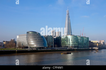 The Shard skyscraper under construction in the London Bridge Quarter,  showing County Hall on the bank of the River Thames Stock Photo