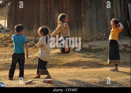 Children playing in a village, Plain of Jars, Phonsavan, Xieng Khouang, Laos Stock Photo