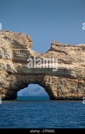 Hole in rock, Muscat, Bay of the  Oman Dive Centre, Muscat, Masqat, Oman Stock Photo