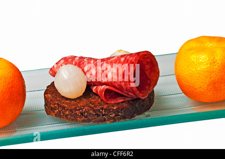 Pumpernickel with salami Stock Photo