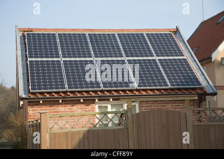 Domestic solar panel array on garage roof Stock Photo