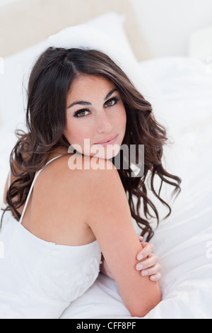 Young attractive bride looking over her shoulder Stock Photo