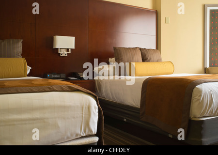 Two beds in a hotel room Stock Photo
