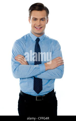 Smiling male businessman with folded arms isolated on white background Stock Photo