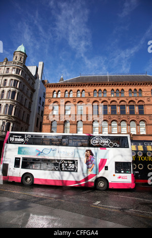 belfast metro citybus double deck bus on donegal square north in front of the richardson owden warehouse building Belfast Stock Photo