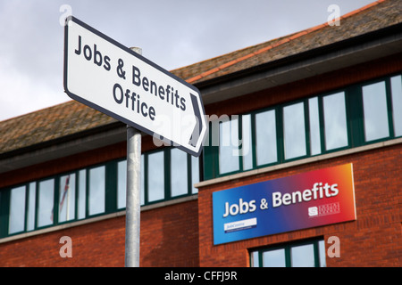 road sign pointing to jobs and benefits office antrim county antrim northern ireland uk Stock Photo