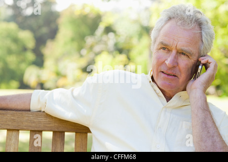 Man making a serious call on his mobile phone Stock Photo