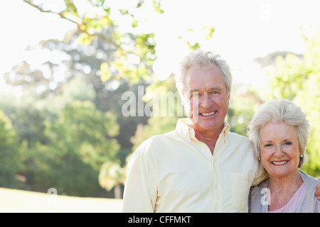 Two friends smiling as they embrace each other Stock Photo