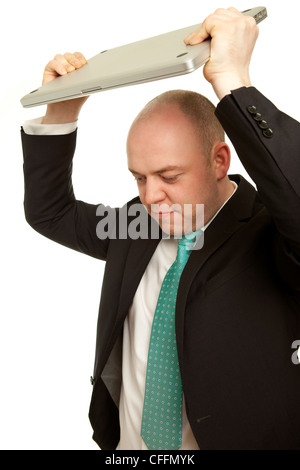 Business man throwing laptop and want to destroy it Stock Photo