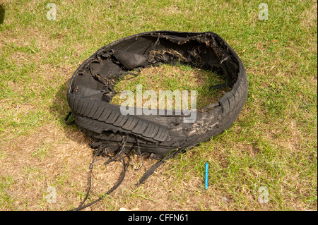 Blown and shredded caravan tyre blowout Stock Photo