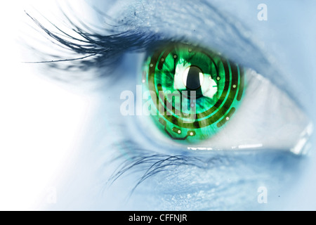 eye iris and green electronic circuit Stock Photo