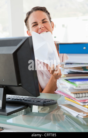 Portrait of a businesswoman with too much work going crazy Stock Photo