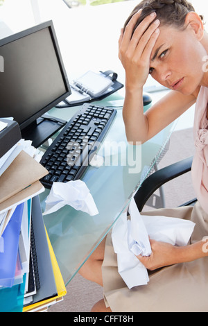 Businesswoman overwhelmed by work Stock Photo
