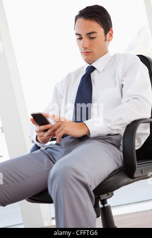 Businessman using his smartphone Stock Photo