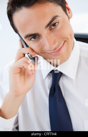 Portrait of a handsome man in suit calling with his smartphone Stock Photo