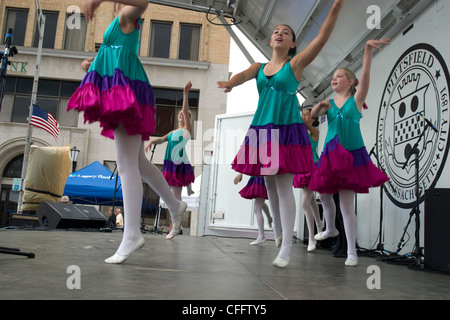 Young ballet students dance on a street fair stage in Pittsfield, Massachusetts. Stock Photo