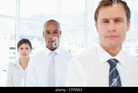 Salespeople standing in a row Stock Photo