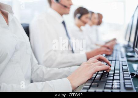 Hands working on keyboards Stock Photo