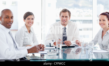 Smiling businesspeople in a meeting Stock Photo