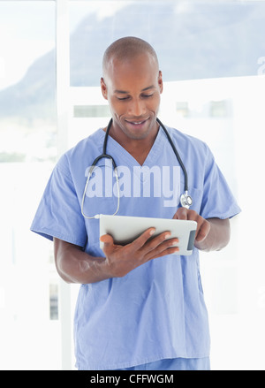 Doctor using tablet computer Stock Photo