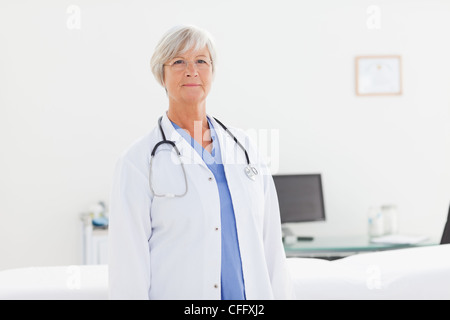 Doctor standing in her office Stock Photo