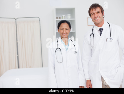 Young smiling doctors standing up side by side Stock Photo