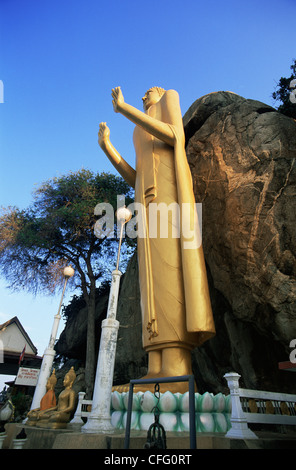 Thailand, Hua Hin, Wat Khao Thairalat, Standing Buddha at Takiap Hill Stock Photo