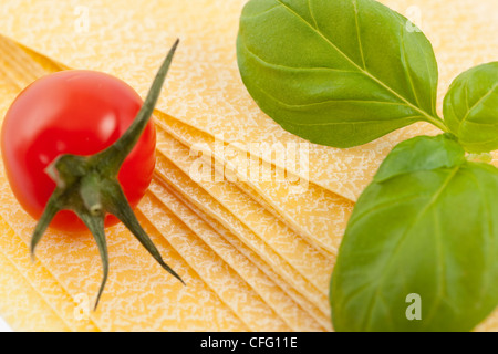 Lasagne sheets ready for cooking with tomato Stock Photo