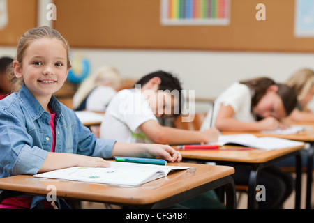 Side view of schoolgirl during class Stock Photo - Alamy