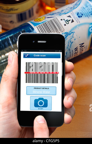 Mobile phone, smart phone, PDA, I phone, with a barcode reader App. To read barcode information on products. Stock Photo