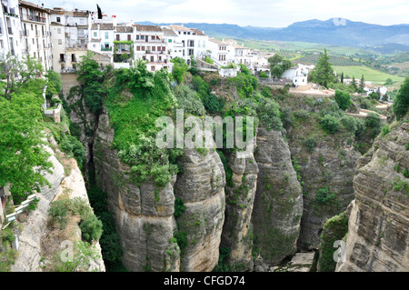 Spain - Malaga province - Ronda - old town above the El Tajo gorge of rio Gudalevin - backdrop Serrania de Ronda mountain Stock Photo