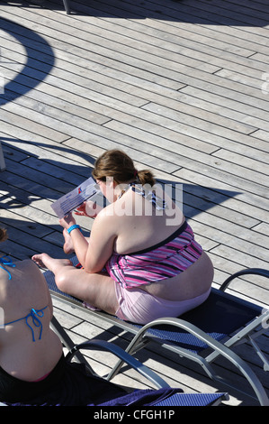 Obese woman on cruise ship Stock Photo