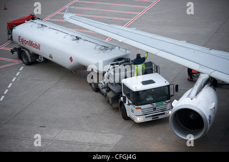 Commercial passenger airliner being refueled, Dusseldorf airport, Germany. Stock Photo