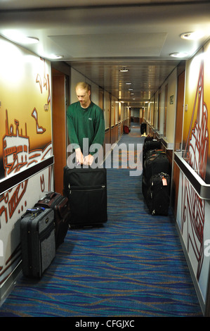 Cruise ship luggage at cabin doors Stock Photo