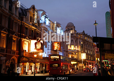 Theatres in Shaftesbury Avenue, the West End of London at  night - theatreland Stock Photo