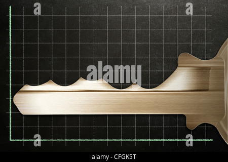 Gold key forming a fluctuating graph Stock Photo