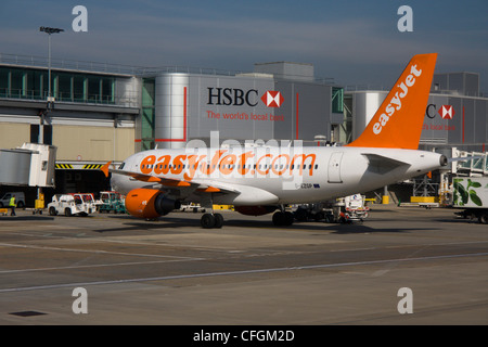 easyjet plane at departure gate london gatwick airport terminal buildings west sussex england uk Stock Photo