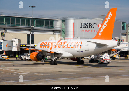 easyjet plane at departure gate london gatwick airport terminal buildings west sussex england uk Stock Photo