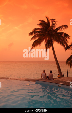 Sunset over the swimming pool, Filitheyo island, Maldives Stock Photo