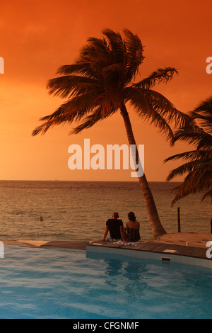Sunset over the swimming pool, Filitheyo island, Maldives Stock Photo