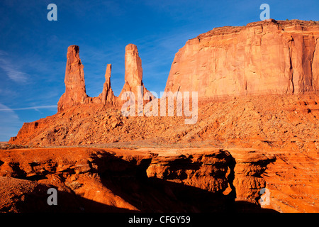 Sunrise over the Three Sisters, Monument Valley, Arizona USA Stock Photo