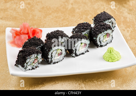 sushi roll with tuna, avacado, sauce and flying fish roe Stock Photo